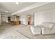 Spacious carpeted basement with a bar area and a comfortable seating area at 937 Caribou Dr, Monument, CO 80132