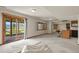 Spacious basement featuring sliding glass doors, a bar area, carpet, and mountain views at 937 Caribou Dr, Monument, CO 80132