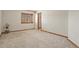 Neutral bedroom with wood trim and a window that brings in natural light at 937 Caribou Dr, Monument, CO 80132