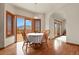 Dining area with mountain views, hardwood floors, and access to the outdoor deck at 937 Caribou Dr, Monument, CO 80132