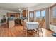 Dining nook with mountain views, hardwood floors, and access to the outdoor patio at 937 Caribou Dr, Monument, CO 80132