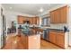 Spacious kitchen featuring an island with granite countertops and stainless steel appliances at 937 Caribou Dr, Monument, CO 80132