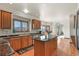 Bright, modern kitchen featuring an island, mountain views, and access to deck area at 937 Caribou Dr, Monument, CO 80132