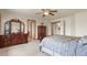 Bright main bedroom with hardwood furniture set, ceiling fan, and a view at 937 Caribou Dr, Monument, CO 80132