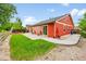 Spacious backyard features a lush lawn, patio area, and privacy fence at 5577 Jasper St, Denver, CO 80239