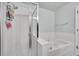 Bathroom featuring stylish glass shower and tub at 5577 Jasper St, Denver, CO 80239