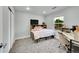 Comfortable bedroom with carpeted floors, a large window, and a built-in bed frame with storage drawers at 5577 Jasper St, Denver, CO 80239
