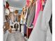 Walk in closet with organized shelving and hanging space at 5577 Jasper St, Denver, CO 80239