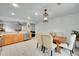 Spacious kitchen with stainless steel appliances, a large sink, and hardwood cabinets at 5577 Jasper St, Denver, CO 80239