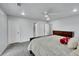 This carpeted main bedroom provides private access to the ensuite bathroom and walk-in closet at 5577 Jasper St, Denver, CO 80239