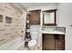 Modern bathroom with stylish vanity, glass vessel sink, and tiled shower at 3355 S Flower St # 107, Lakewood, CO 80227