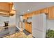Bright kitchen with granite counters, wooden cabinets, white appliances and ample storage at 3355 S Flower St # 107, Lakewood, CO 80227