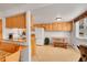 Bright kitchen with ample cabinetry, modern appliances, and breakfast bar seating at 3355 S Flower St # 107, Lakewood, CO 80227
