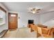 Bright living room featuring a front door and a staircase to upper level at 3355 S Flower St # 107, Lakewood, CO 80227