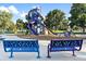 Community playground with slides, climbing structures, and benches for parents at 3355 S Flower St # 107, Lakewood, CO 80227
