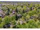 Lovely aerial view of a classic brick home surrounded by green trees in a peaceful neighborhood setting at 6300 E 17Th Avenue Pkwy, Denver, CO 80220