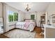 Inviting bedroom with a soft rug, natural light, and a cozy atmosphere, perfect for relaxation at 6300 E 17Th Avenue Pkwy, Denver, CO 80220