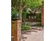Secluded brick patio featuring lush greenery, garden decor, and comfortable outdoor seating at 6300 E 17Th Avenue Pkwy, Denver, CO 80220