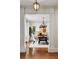 Dining room with hardwood floors, decorative chandelier, and large window at 6300 E 17Th Avenue Pkwy, Denver, CO 80220