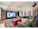Entertainment room featuring a large screen, comfortable seating, and decorative wall panels at 6300 E 17Th Avenue Pkwy, Denver, CO 80220