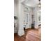 Elegant entryway with white trim, hardwood floors, and leaded glass door at 6300 E 17Th Avenue Pkwy, Denver, CO 80220