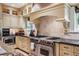 Elegant kitchen with custom cabinetry, granite countertops, and a high-end stainless steel range at 6300 E 17Th Avenue Pkwy, Denver, CO 80220