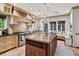 Gourmet kitchen with a large island, custom cabinetry, and high-end stainless steel appliances at 6300 E 17Th Avenue Pkwy, Denver, CO 80220