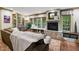 Living room with built-in shelving, a window seat, and a fireplace at 6300 E 17Th Avenue Pkwy, Denver, CO 80220