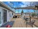 Outdoor deck with a grill, seating area, and inviting space for relaxation and entertainment at 3863 S Bahama St, Aurora, CO 80013
