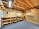 Unfinished basement workshop with workbench, shelving, and carpeted floors at 3863 S Bahama St, Aurora, CO 80013