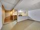 Unfinished basement featuring a bar area with stools and a bright and open additional room at 3863 S Bahama St, Aurora, CO 80013