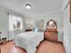 Bright bedroom with a comfortable bed, a large window with lots of natural light, and hardwood floors at 3863 S Bahama St, Aurora, CO 80013
