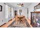 Traditional dining room with a wooden table, chairs, and ample natural light at 3863 S Bahama St, Aurora, CO 80013