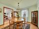 Inviting dining room with a round table, classic decor, and a glimpse into a cozy living space at 3863 S Bahama St, Aurora, CO 80013