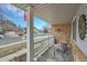Inviting front porch with charming decor and a view of the neighborhood's American flag at 3863 S Bahama St, Aurora, CO 80013