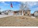 Inviting single-Gathering home featuring brick accents and a charming, partially-covered front porch at 3863 S Bahama St, Aurora, CO 80013