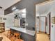 Stylish kitchen featuring a breakfast bar with seating, stainless steel appliances, and modern lighting at 3863 S Bahama St, Aurora, CO 80013