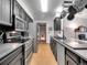 Modern kitchen with stainless steel appliances, sleek countertops, and ample cabinet space at 3863 S Bahama St, Aurora, CO 80013