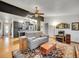 Open-concept living room flows into the kitchen, featuring a comfortable sofa and decorative accents at 3863 S Bahama St, Aurora, CO 80013