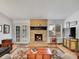 Inviting living room with fireplace, lots of light, wood floors, and French doors at 3863 S Bahama St, Aurora, CO 80013
