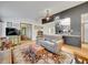 Inviting living room featuring a comfortable sofa, hardwood floors, and a stylish rug at 3863 S Bahama St, Aurora, CO 80013