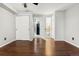 Bright bedroom featuring hard wood floors and two closets with white doors at 1885 S Quebec Way # A28, Denver, CO 80231