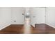 Bedroom featuring hard wood floors, baseboard trim and one closet with white doors at 1885 S Quebec Way # A28, Denver, CO 80231