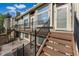 Inviting two-story townhouse featuring stairs, updated deck, and ample natural light at 1885 S Quebec Way # A28, Denver, CO 80231