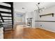 Bright living room featuring a fireplace, updated staircase, and large window at 1885 S Quebec Way # A28, Denver, CO 80231