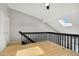 This loft space features a skylight and a half wall with black wooden supports at 1885 S Quebec Way # A28, Denver, CO 80231