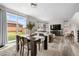 Open-concept dining area connecting to the living room with natural light and stylish decor at 27674 E 7Th Dr, Aurora, CO 80018