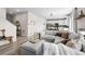 Open-concept living room, seamlessly connecting to a modern kitchen and dining area at 27674 E 7Th Dr, Aurora, CO 80018