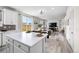 Open-concept living space featuring kitchen, dining area, and living room with bright, neutral decor at 27674 E 7Th Dr, Aurora, CO 80018