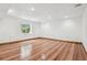 Spacious unfurnished basement has laminate floors, recessed lighting, and a garden window at 4720 S Grant St, Englewood, CO 80113
